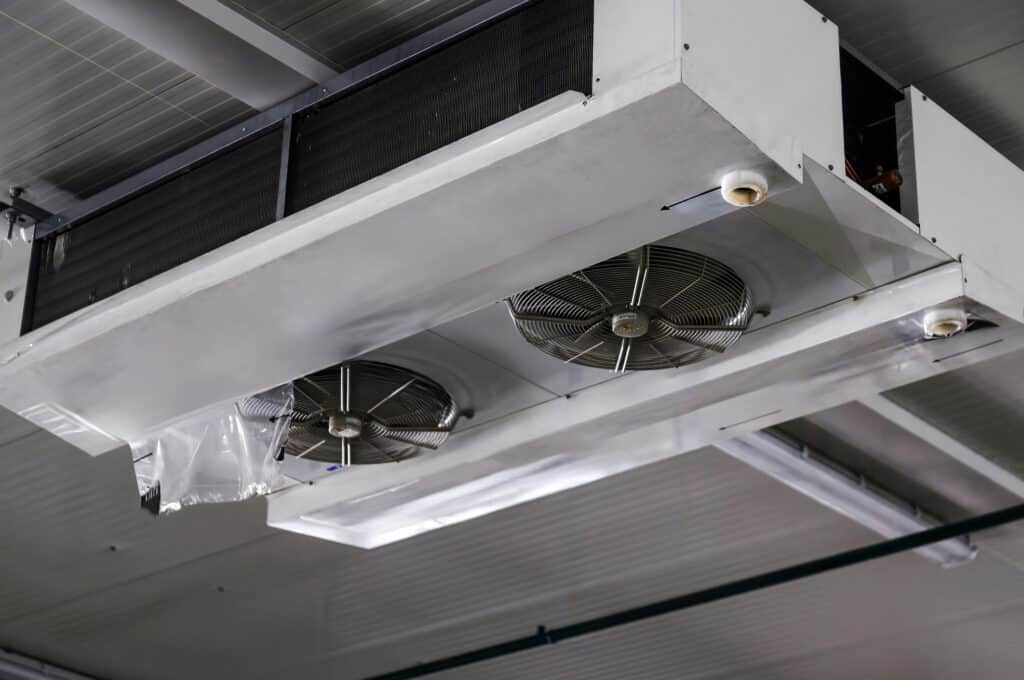 Commercial HVAC unit with integrated fans installed for efficient climate control in an industrial facility.